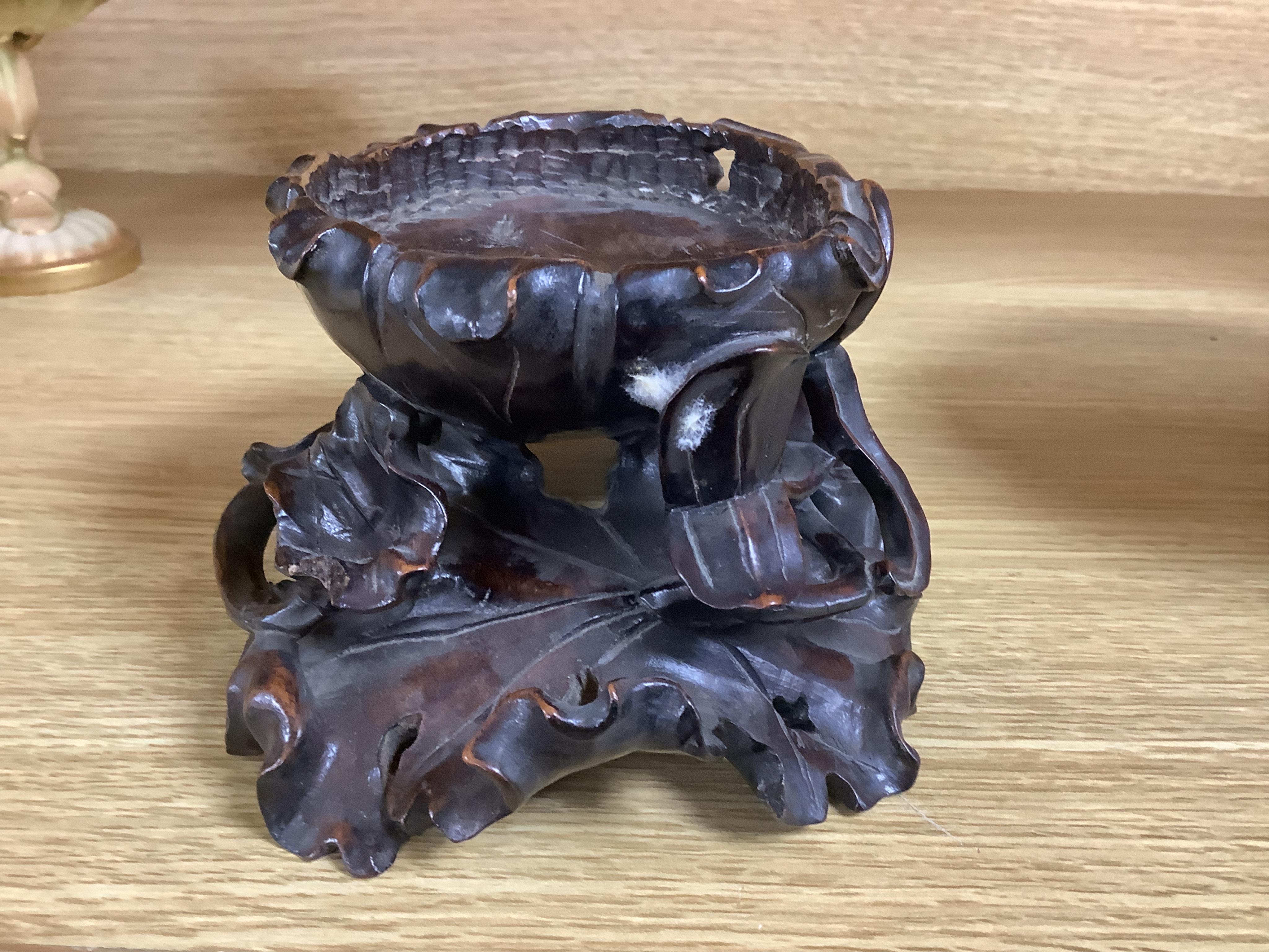 A Chinese hardwood vase stand, 8cm high. Condition - fair to good, some losses